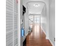 Bright hallway boasts hardwood floors and arched doorways leading to various rooms in the home at 6625 Story Cir, Norcross, GA 30093