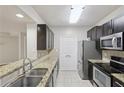 Well-equipped kitchen with granite countertops, stainless steel appliances, and tiled backsplash at 1250 Parkwood Se Cir # 2201, Atlanta, GA 30339