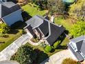 Beautiful home with a well-maintained lawn and mature trees, creating a private and serene setting at 1630 Chadwick Mill Ln, Lawrenceville, GA 30043