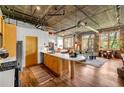 Modern kitchen with stainless steel appliances and large island, opening to living room for entertaining at 3235 Roswell Ne Rd # 508, Atlanta, GA 30305