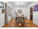 Bright dining area featuring hardwood floors, modern lighting, and seating for four, ideal for Gathering meals at 1150 Collier Nw Rd # A7, Atlanta, GA 30318