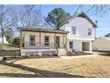 Charming two-story home with a welcoming front porch and landscaped yard, offering a blend of comfort and curb appeal at 1382 Bennett Rd, Grayson, GA 30017