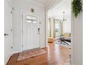 Inviting entryway showcases hardwood floors and stylish decor, leading into a bright living space at 2815 Paddle Point Ln, Cumming, GA 30041