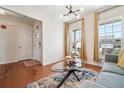 Cozy living room with ample natural light, showcasing hardwood floors and modern decor at 2815 Paddle Point Ln, Cumming, GA 30041
