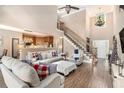 Spacious living room with soaring ceilings, natural light, and open layout to the kitchen, ideal for entertaining at 90 Belleview Rdg, Sharpsburg, GA 30277