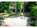 Spacious backyard with a concrete patio and fire pit, perfect for outdoor entertaining at 1774 Pennington Se Pl, Atlanta, GA 30316