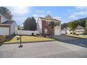 Two story home with a well-manicured lawn and an attached one-car garage at 206 Oak Grove Way, Acworth, GA 30102