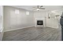 Bright living room with hardwood floors, a decorative fireplace, and lots of natural light at 206 Oak Grove Way, Acworth, GA 30102