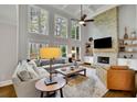 Spacious living room features soaring ceilings, fireplace and an abundance of natural light at 3022 Woodbridge Ln, Canton, GA 30114