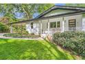 Attractive white home with attached carport and charming front porch at 4020 Morgan Rd, Tucker, GA 30084