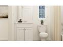 Bright bathroom with a sleek white vanity, a contemporary mirror, and stylish decor at 120 Sunny Side Way, Acworth, GA 30102