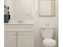 Elegant bathroom featuring a white vanity with marble countertop, complemented by chic decor at 120 Sunny Side Way, Acworth, GA 30102