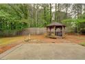 Serene backyard featuring a charming gazebo, perfect for outdoor relaxation and entertaining at 1917 Kevin Dr, Conyers, GA 30013