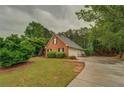 Beautiful home with a two-car garage, well-maintained lawn, and lovely landscaping at 1917 Kevin Dr, Conyers, GA 30013