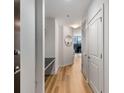 Inviting hallway featuring wood floors, white trim, and a view to the living room, enhancing the home's flow at 855 Peachtree Ne St # 2706, Atlanta, GA 30308