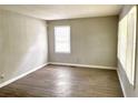 Bright bedroom with wood-look floors and neutral walls, offering a calm retreat at 955 Margaret Nw Pl, Atlanta, GA 30318
