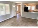 Open living space with modern flooring and lots of natural light, leading into the kitchen at 955 Margaret Nw Pl, Atlanta, GA 30318