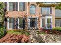 Close-up of the brick home's front entry, showcasing the door and surrounding details at 6221 Woodlore Nw Dr, Acworth, GA 30101