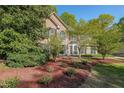 Inviting brick home featuring mature landscaping and attractive curb appeal at 6221 Woodlore Nw Dr, Acworth, GA 30101