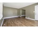 Open living room features hardwood floors and an arched doorway into another room at 1958 Long Dr, Decatur, GA 30032