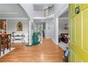 Inviting foyer with hardwood floors, staircase, and views into the dining and living areas at 1207 Promontory Path, Marietta, GA 30062