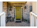 Charming front door with brick facade, decorative plants and elegant lighting at 1207 Promontory Path, Marietta, GA 30062