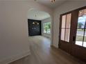 Inviting entryway with hardwood floors and archway to the dining area at 380 Hillcrest View Dr, Suwanee, GA 30024