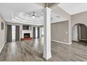 Spacious living room with hardwood floors, fireplace, and decorative trey ceiling at 1635 Round Rd, Grayson, GA 30017