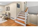 Beautiful staircase with hardwood steps and white banister, leading to the upper level at 380 Amberidge Trl, Atlanta, GA 30328