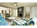 Inviting living room with a fireplace, elegant decor, and stairs to the next level at 104 Holcomb Ferry Rd, Roswell, GA 30076