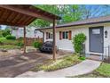 Well-kept home with covered carport, brick accents, and inviting entrance at 605 Rocky Branch Rd, Villa Rica, GA 30180