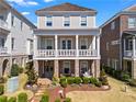 Charming two-story home features a landscaped front yard, a covered porch, and a combination of brick and siding at 7515 Cordery Rd, Cumming, GA 30040