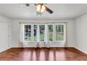 Bright, airy living room with hardwood floors, fan and large windows at 856 Glenway Dr, East Point, GA 30344