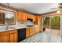 Kitchen featuring wood cabinets, white countertops, and sliding glass door to the outdoor deck at 3450 Brookhill Cir, Marietta, GA 30062