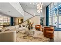 Inviting building lobby features lounge seating, large windows and a staircase with contemporary fixtures at 711 Cosmopolitan Ne Dr # 213, Atlanta, GA 30324