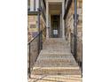 A stone staircase leads to the front door of this home, framed by matching stone walls at 1129 Cordia Nw Ave, Atlanta, GA 30318