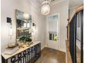 Bright foyer featuring decorative mirror, elegant lighting, and a view to the outside at 1129 Cordia Nw Ave, Atlanta, GA 30318