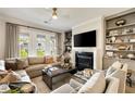 Inviting living room with fireplace, built-in bookshelves, and an oversized sectional sofa at 1129 Cordia Nw Ave, Atlanta, GA 30318