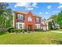 Charming brick-front home with well-maintained landscaping and attached two-car garage at 5147 Winding Glen Dr, Lithonia, GA 30038