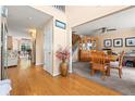 Open-concept hallway with hardwood floors leading to a dining room and living area at 5147 Winding Glen Dr, Lithonia, GA 30038
