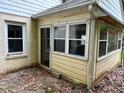 Rear of property with enclosed porch and windows for natural lighting at 1604 Steele Nw Dr, Atlanta, GA 30309