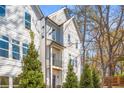 Charming exterior showcasing a two-story home with large windows and a balcony at 490 Hammons Way, Atlanta, GA 30315