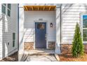 Inviting front entrance showcases a stylish door, stone accents, and manicured shrubbery for a welcoming curb appeal at 490 Hammons Way, Atlanta, GA 30315