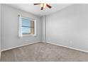 Bright bedroom featuring carpeted floors and a large window at 1500 Tara Pl # 810, Hampton, GA 30228