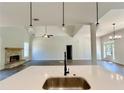 Modern kitchen featuring a center island, pendant lighting, and open floor plan at 31 Cedar Gate Ln, Kingston, GA 30145