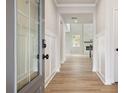 Inviting foyer with wood-look floors and decorative trim, leading to the main living area at 719 Crossroad Ct, Powder Springs, GA 30127
