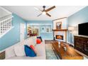 Cozy living space featuring a fireplace, wood floors, and an open layout at 10900 Wittenridge Dr # C1, Alpharetta, GA 30022
