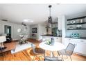 Cozy living room and eat-in kitchen featuring modern finishes and ample natural light at 1412 Woodbine Se Ave, Atlanta, GA 30317