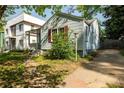 This is the side view of a single-story home showing the driveway and quaint landscaping at 1594 Lincoln Se Ave, Atlanta, GA 30317