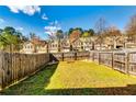 Fenced yard with green grass, ideal for outdoor activities at 2325 Thackery Rd, Snellville, GA 30078